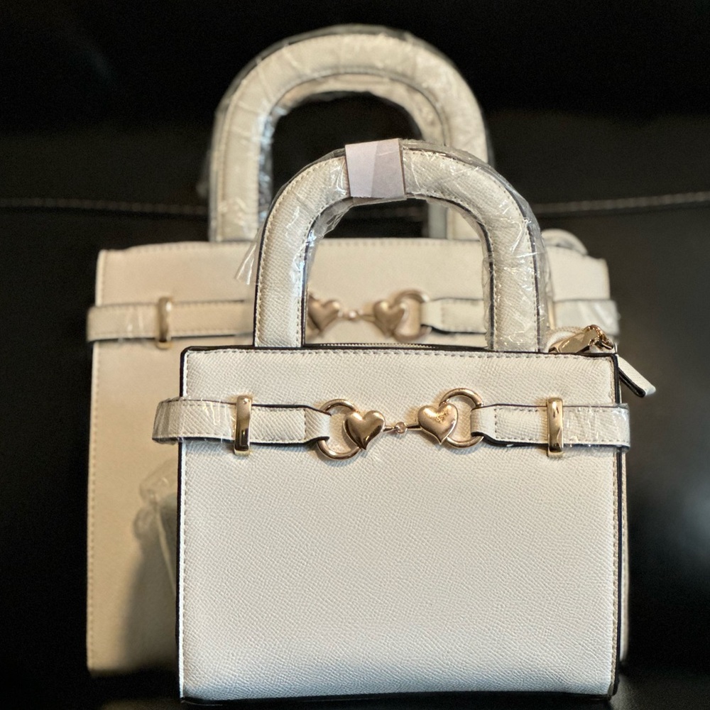 White purses with gold accessories